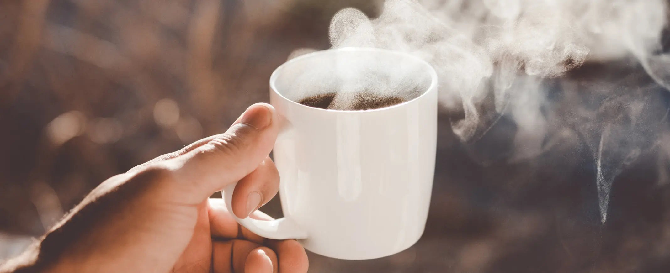 Steaming mug of hot coffee